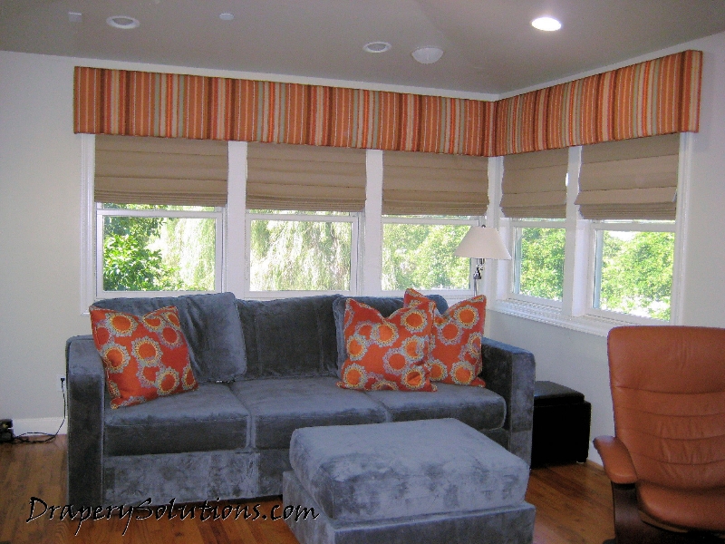 Corner window straight cornice with dowel-back roman shades by Drapery Solutions.