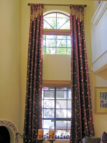 Two story window drapery with gathered tabs and ruched sleeve by Drapery Solutions.