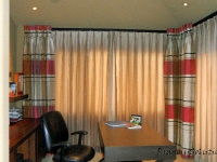 Stationary panels with lined functional sheers by Drapery Solutions.