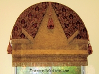 Arched flat roman shade by Drapery Solutions.