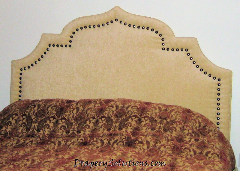 Headboard with nailheads by Drapery Solutions.