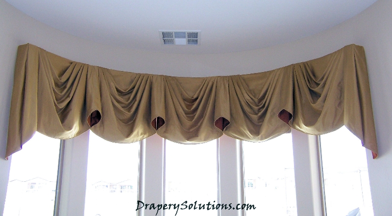 Elaborate empire valance for bowed window by Drapery Solutions.