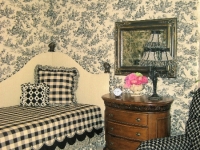 Upholstered walls with toile and welt by Drapery Solutions.